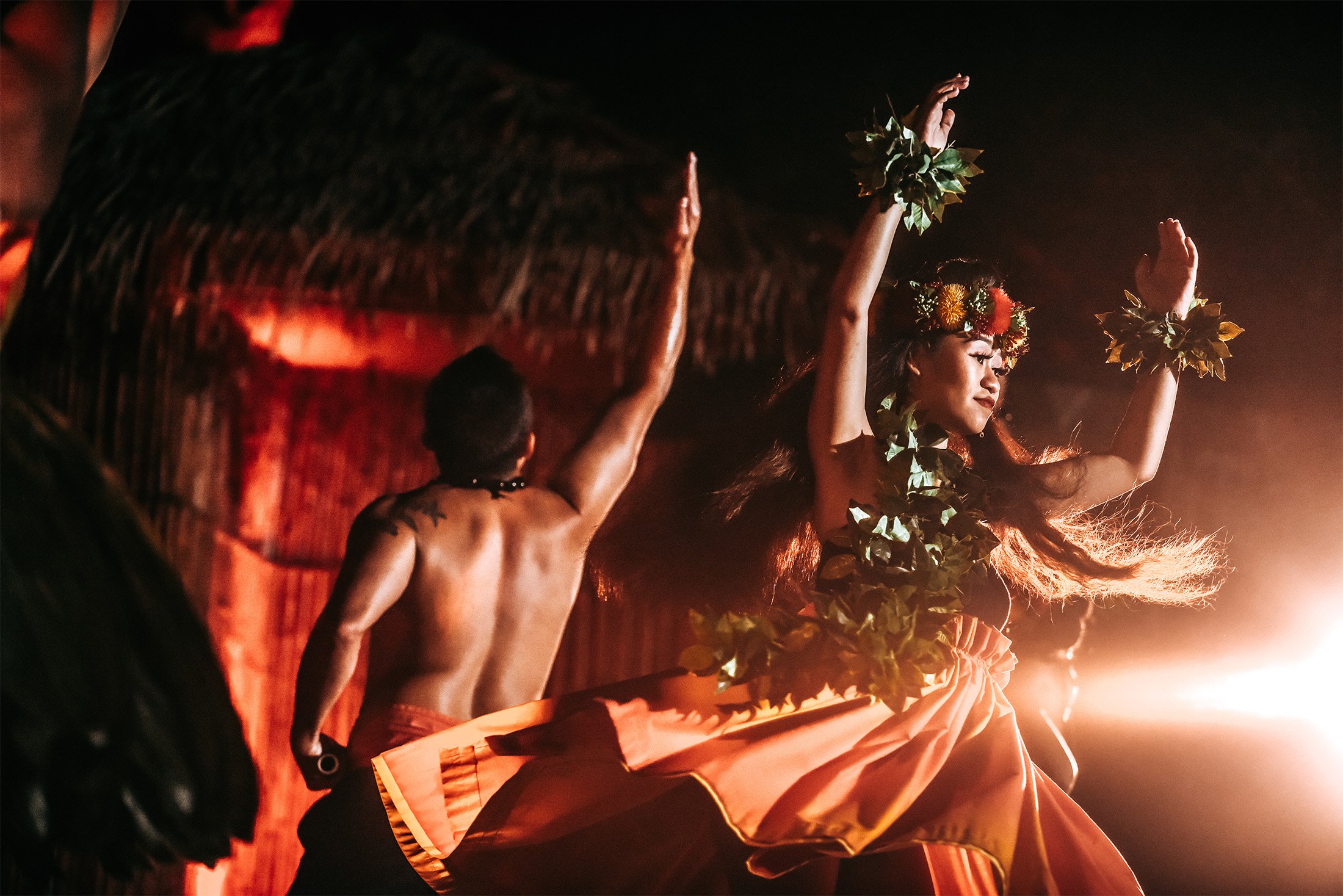 Hawaiian Luau dancer with skirt flowing around her