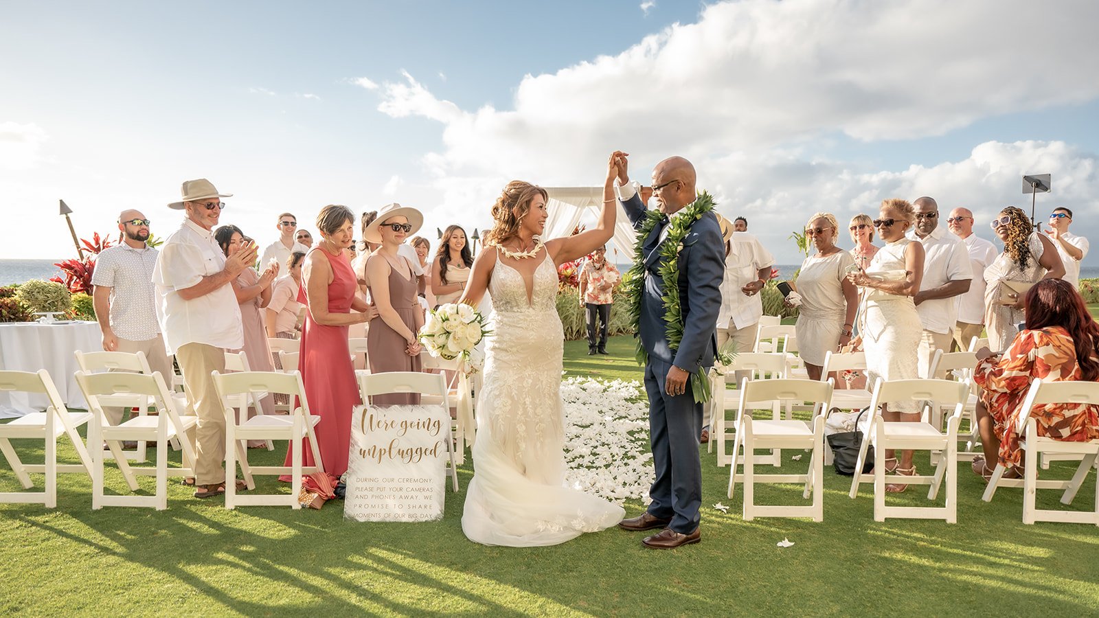 Wedding couple with family in front of alter