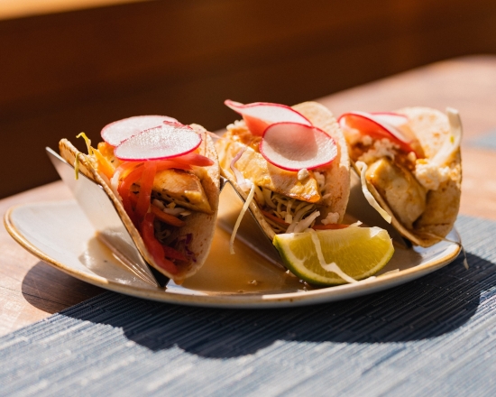 tacos with radish slices on top
