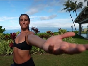 Woman at a garden in front of the Maui beach | Yoga Class at Royal Lahaina