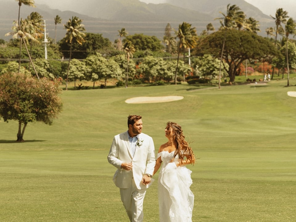 couple celebrating their wedding on the grounds at Royal Lahaina