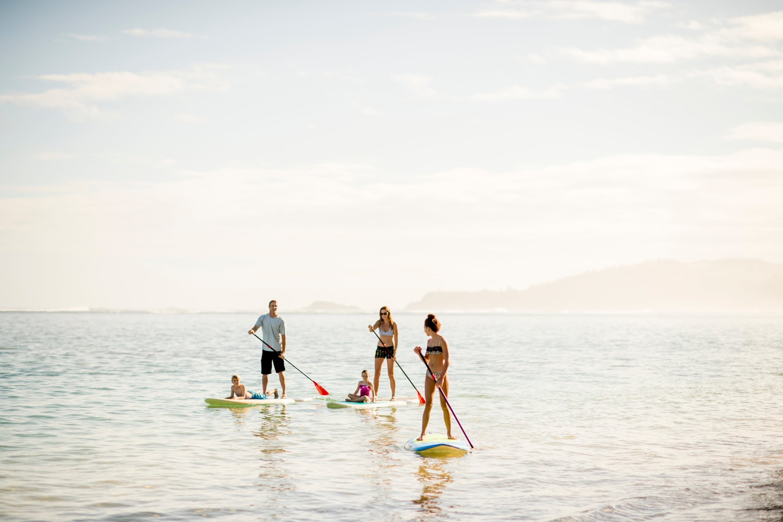 A family on a paddle board in Hawaii